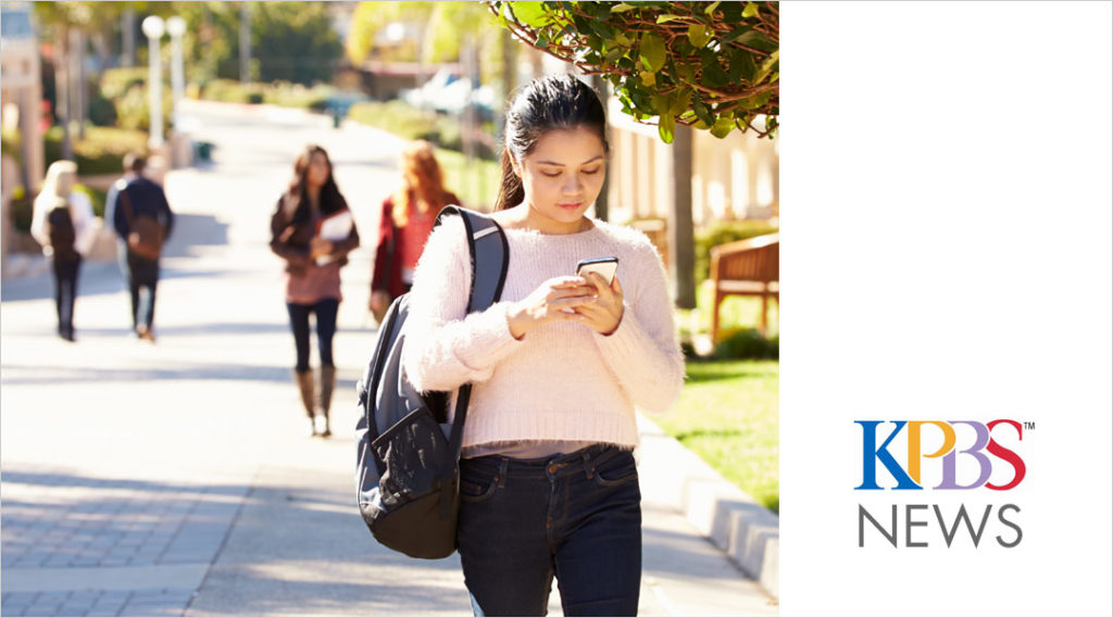 students walking through college campus