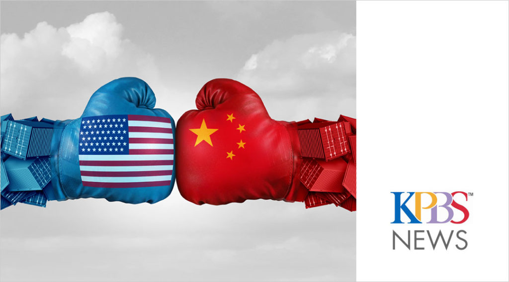blue and red boxing gloves with US and China flags glove to glove